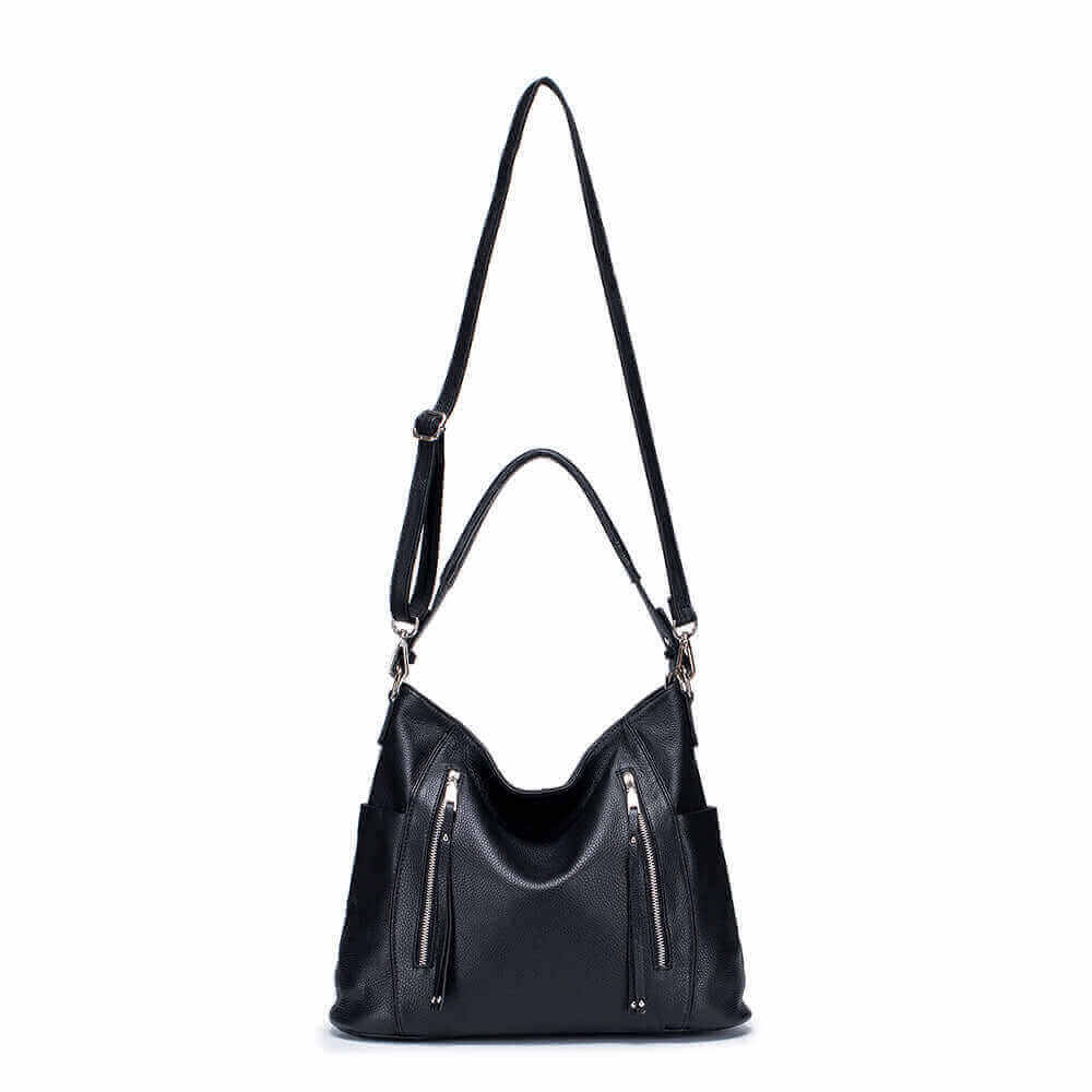 Minimalist black leather crossbody bag for everyday use.