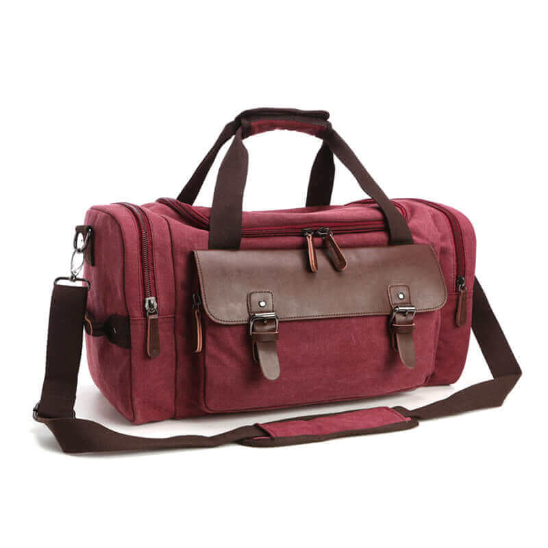 A rugged canvas gym bag with PU leather details and durable straps.