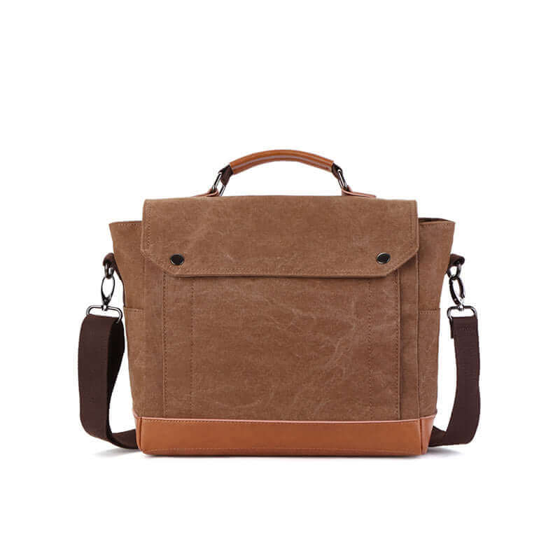 A detailed view of the men's canvas messenger bag with PU leather accents, showcasing the front side with a flap closure.