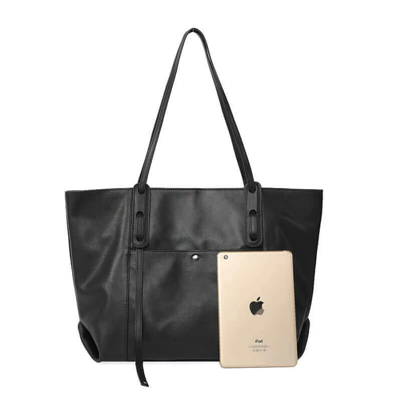 Large women’s leather tote bag in black, perfect for carrying all your essentials.