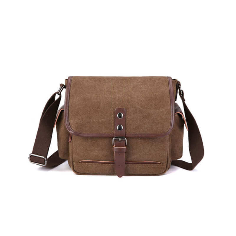 Casual canvas shoulder bag with large capacity and stylish buckle closure.