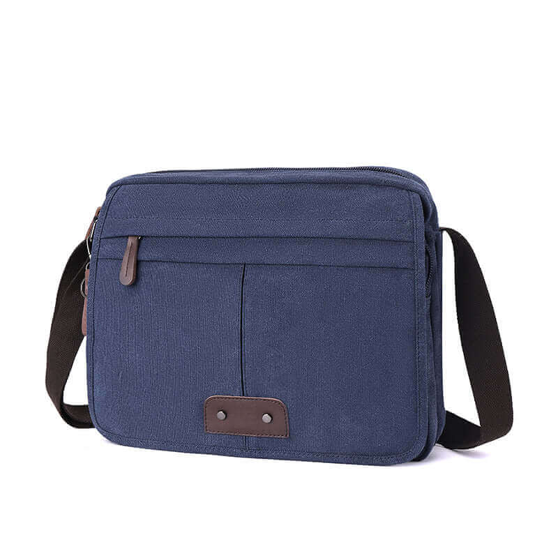 Lightweight men's canvas crossbody messenger bag, designed to fit 13.3 inch laptop, crafted from canvas.