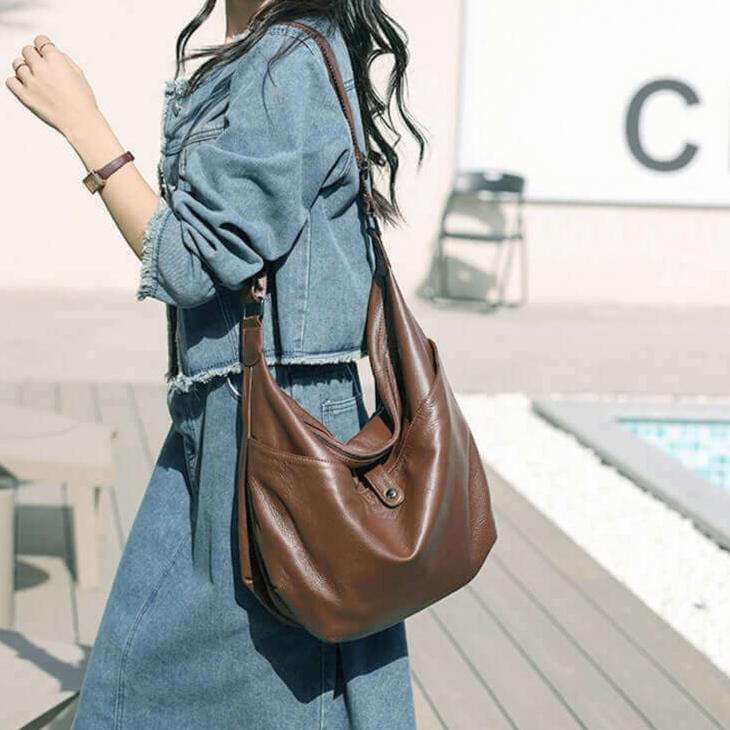 Soft brown leather shoulder bag with a spacious design for women