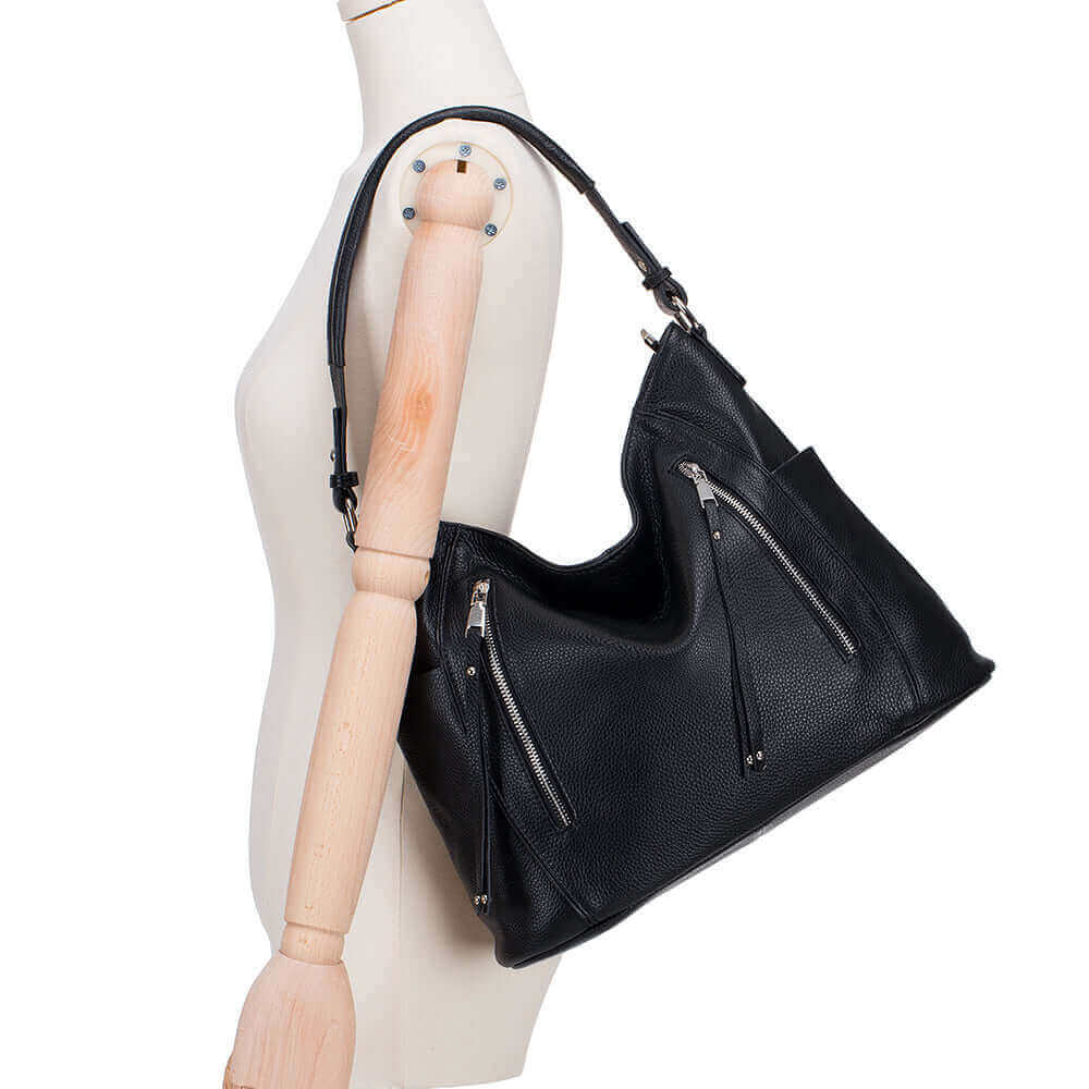 Stylish leather shoulder bag designed for women, featuring elegant straps.