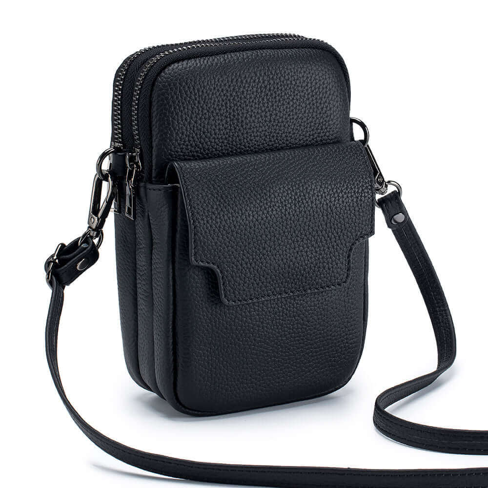 Black genuine leather vertical crossbody bag, lightweight and compact for daily use.