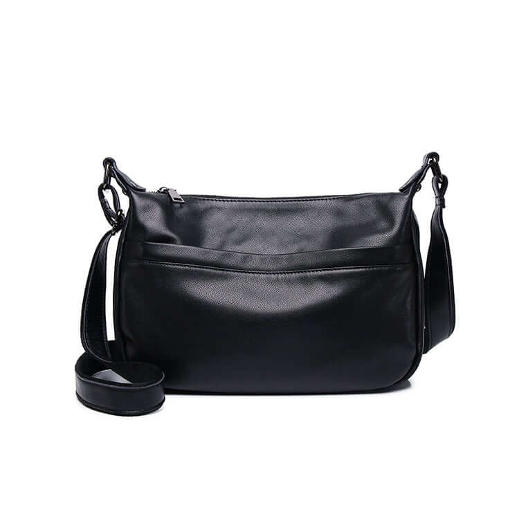 Interior compartment of black crossbody handbag