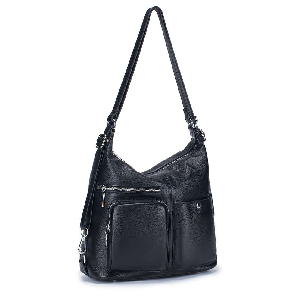 Stylish black leather backpack worn as a shoulder bag.