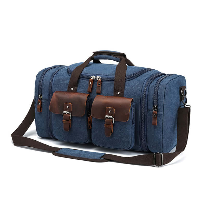 Side view of blue canvas holdall with adjustable shoulder strap