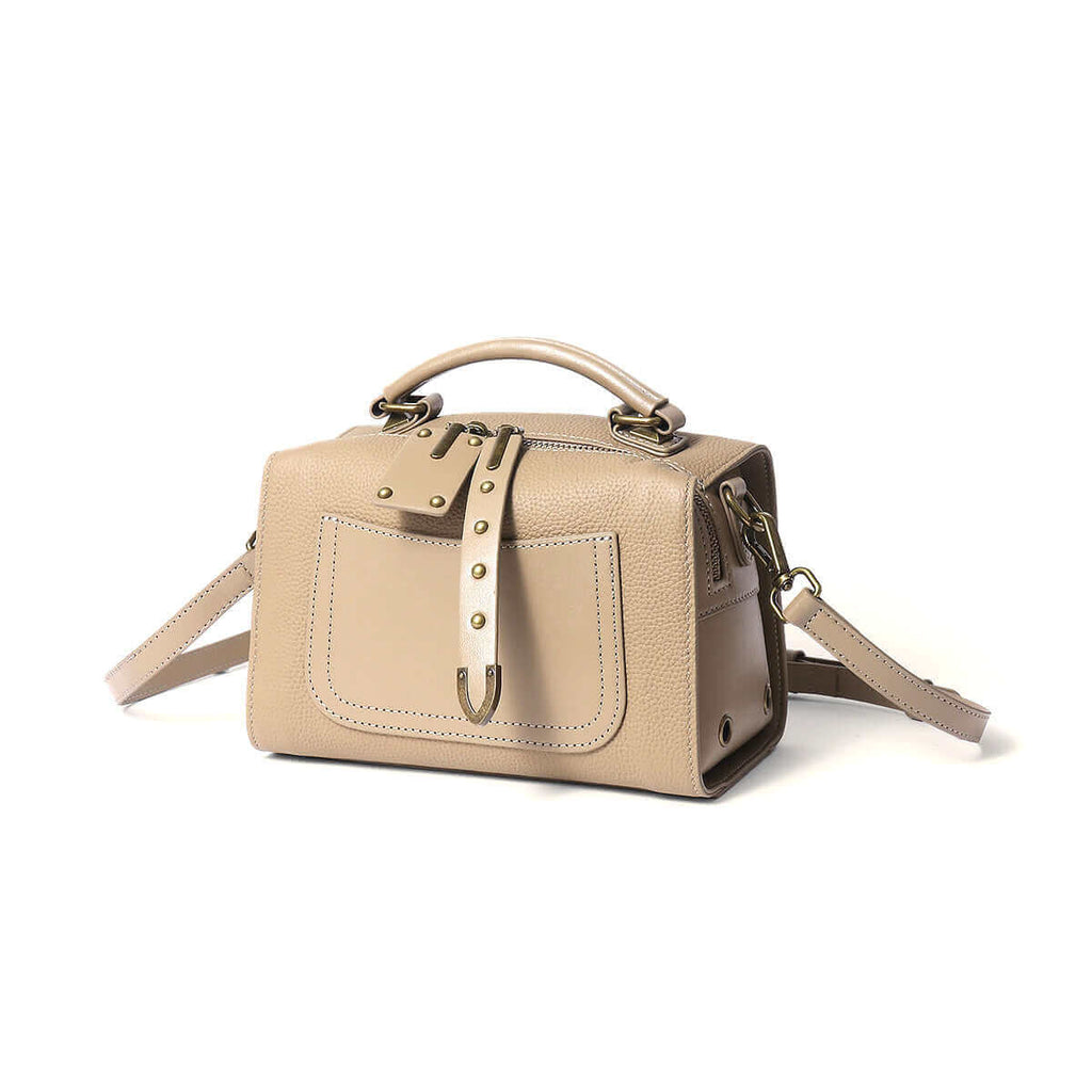 Women's leather box bag styled for versatile use.

