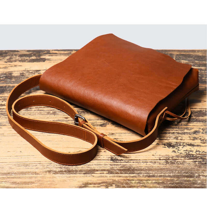 Stylish vintage brown leather crossbody bag for work or leisure.