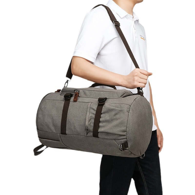 Model carrying the bag as a shoulder duffel