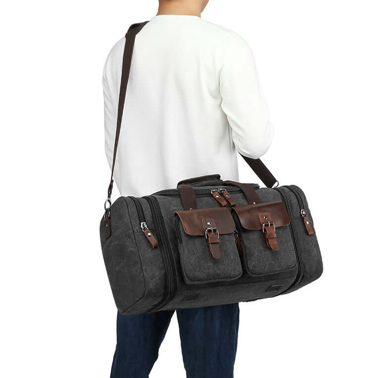 Duffel bag carried by male model as crossbody travel bag