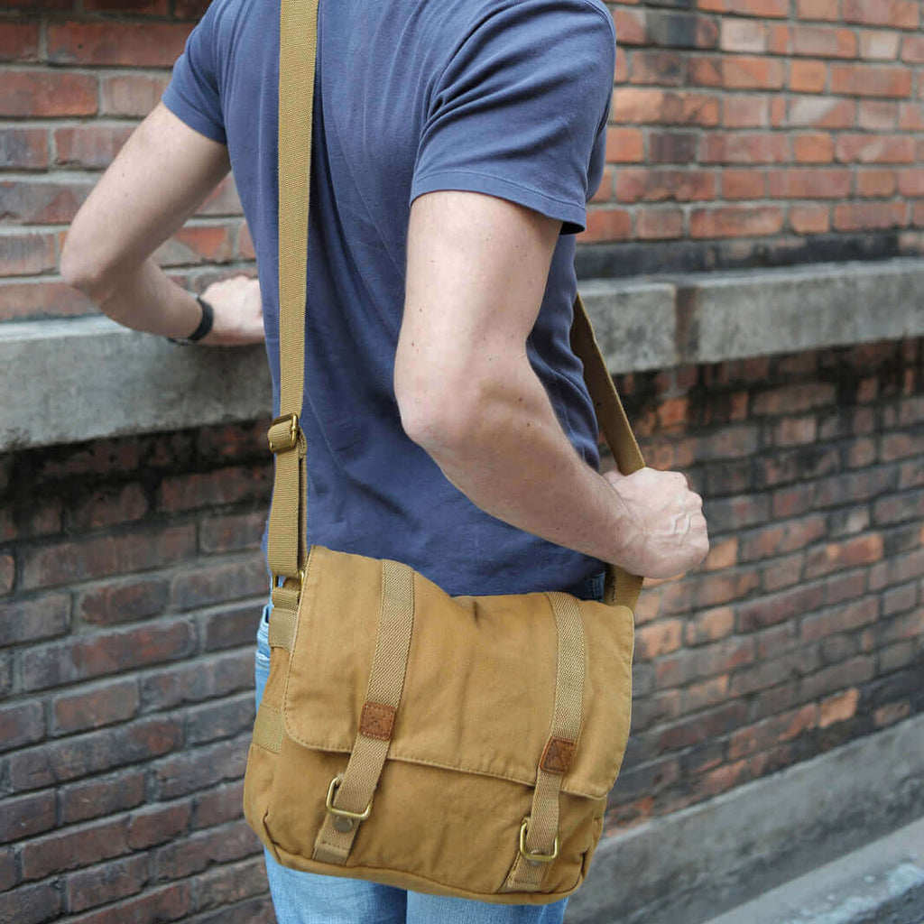 Man wearing the canvas crossbody messenger bag for travel