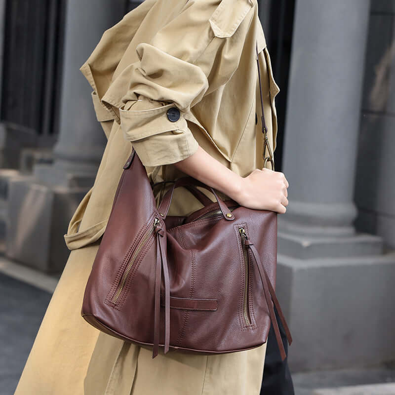 Coffee brown leather tote worn over the shoulder