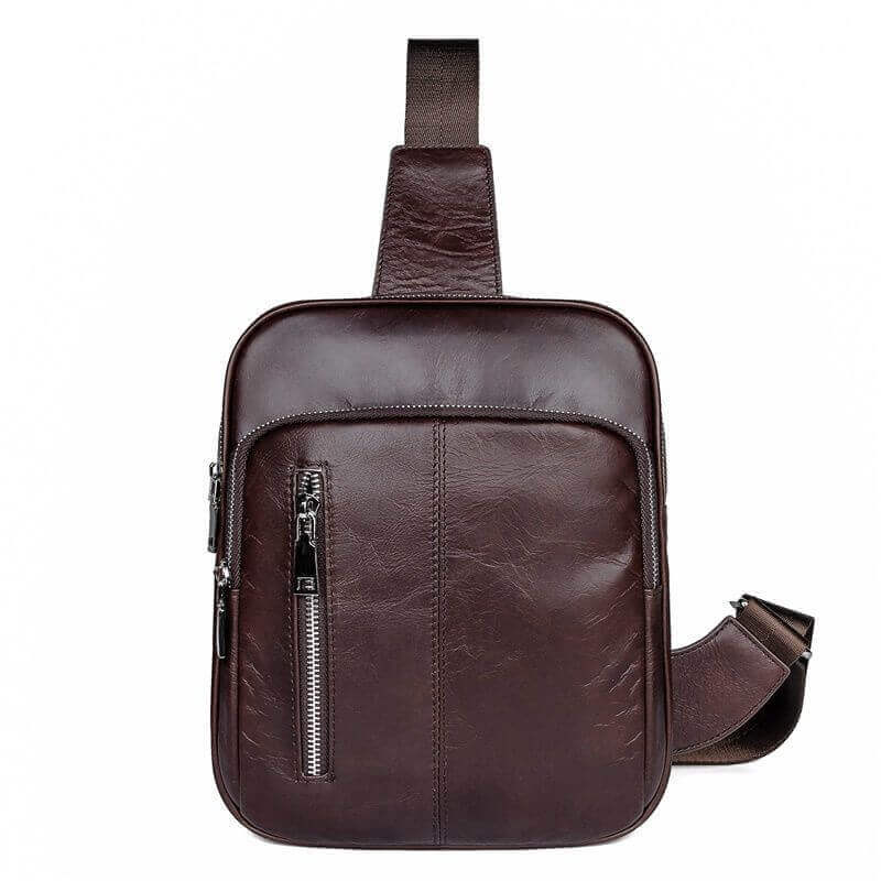 Front view of men's coffee leather sling bag with zippered compartments