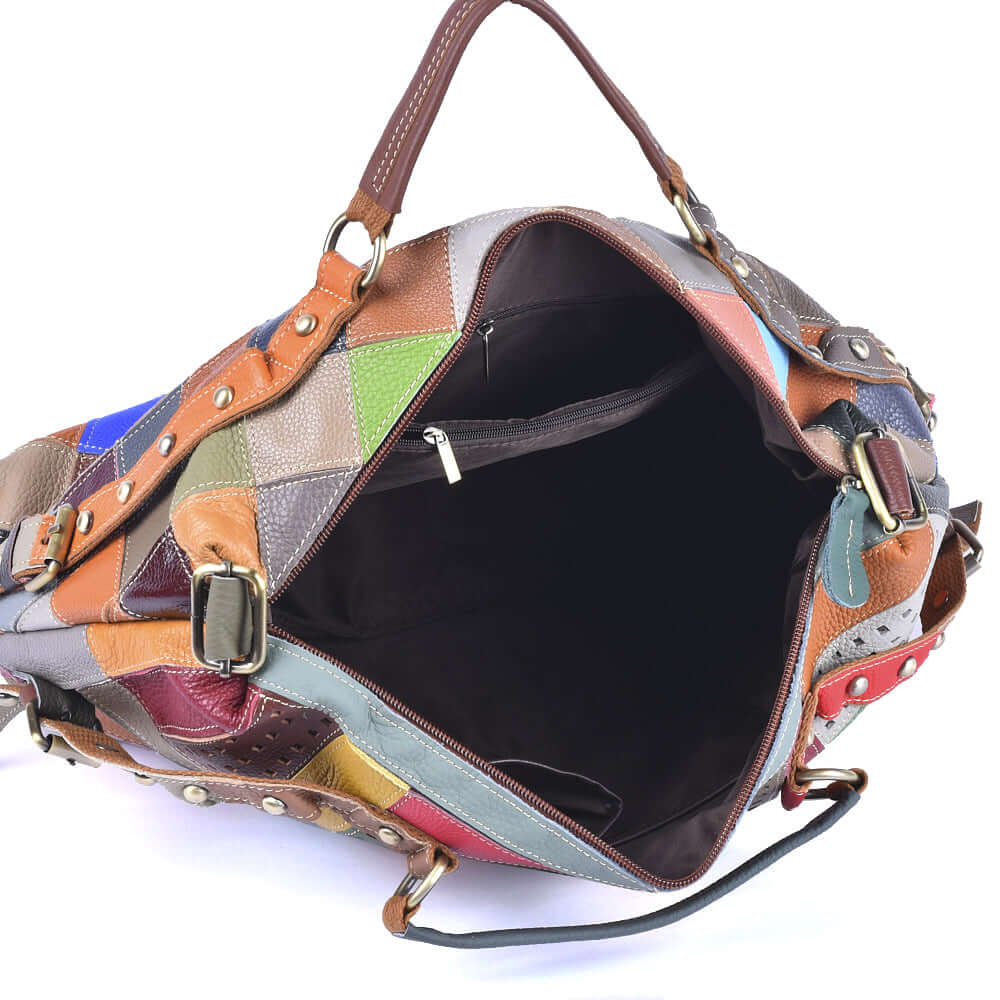 Interior view of spacious colorful leather patchwork handbag with compartments.