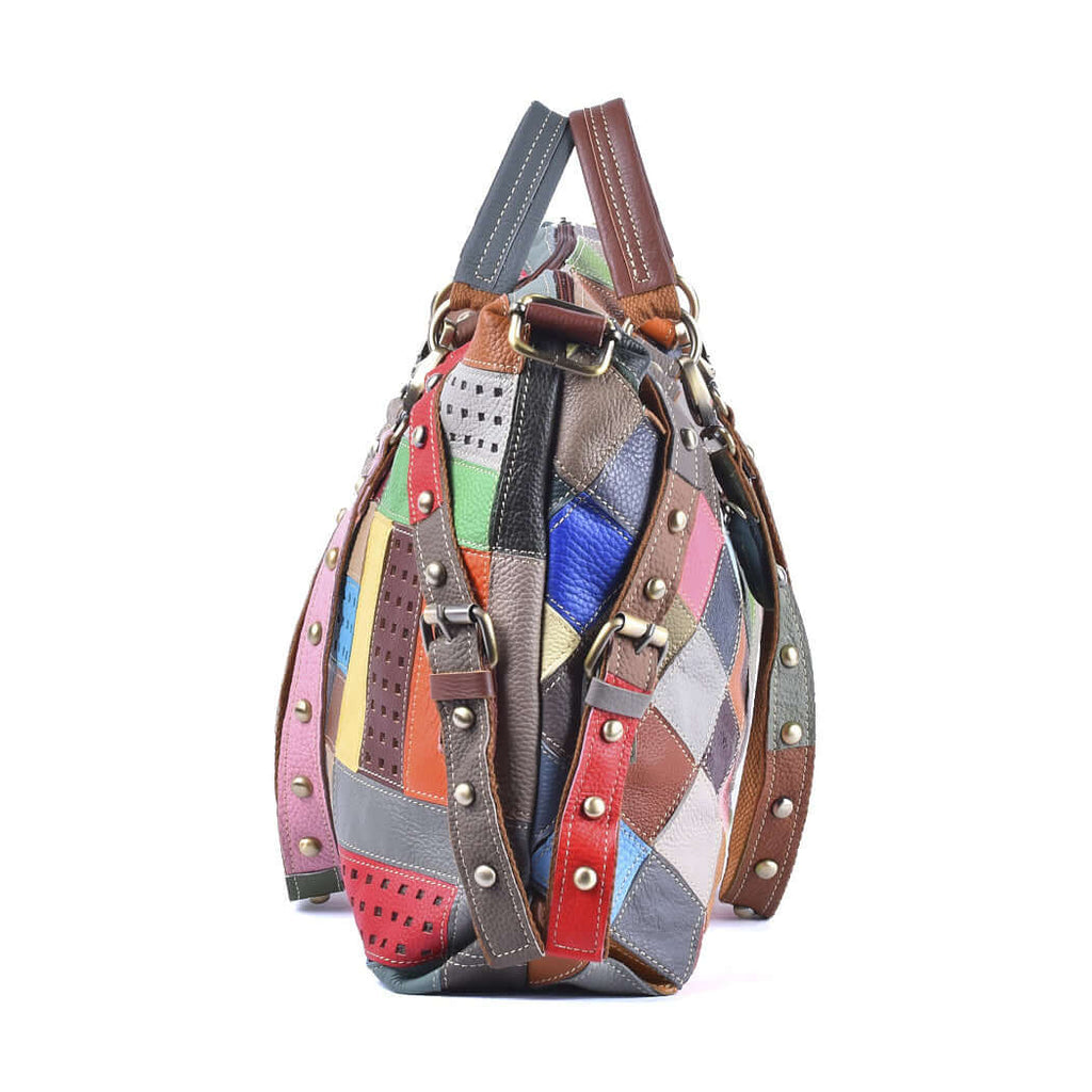 Side view of spacious colorful leather patchwork handbag with multiple strap options.