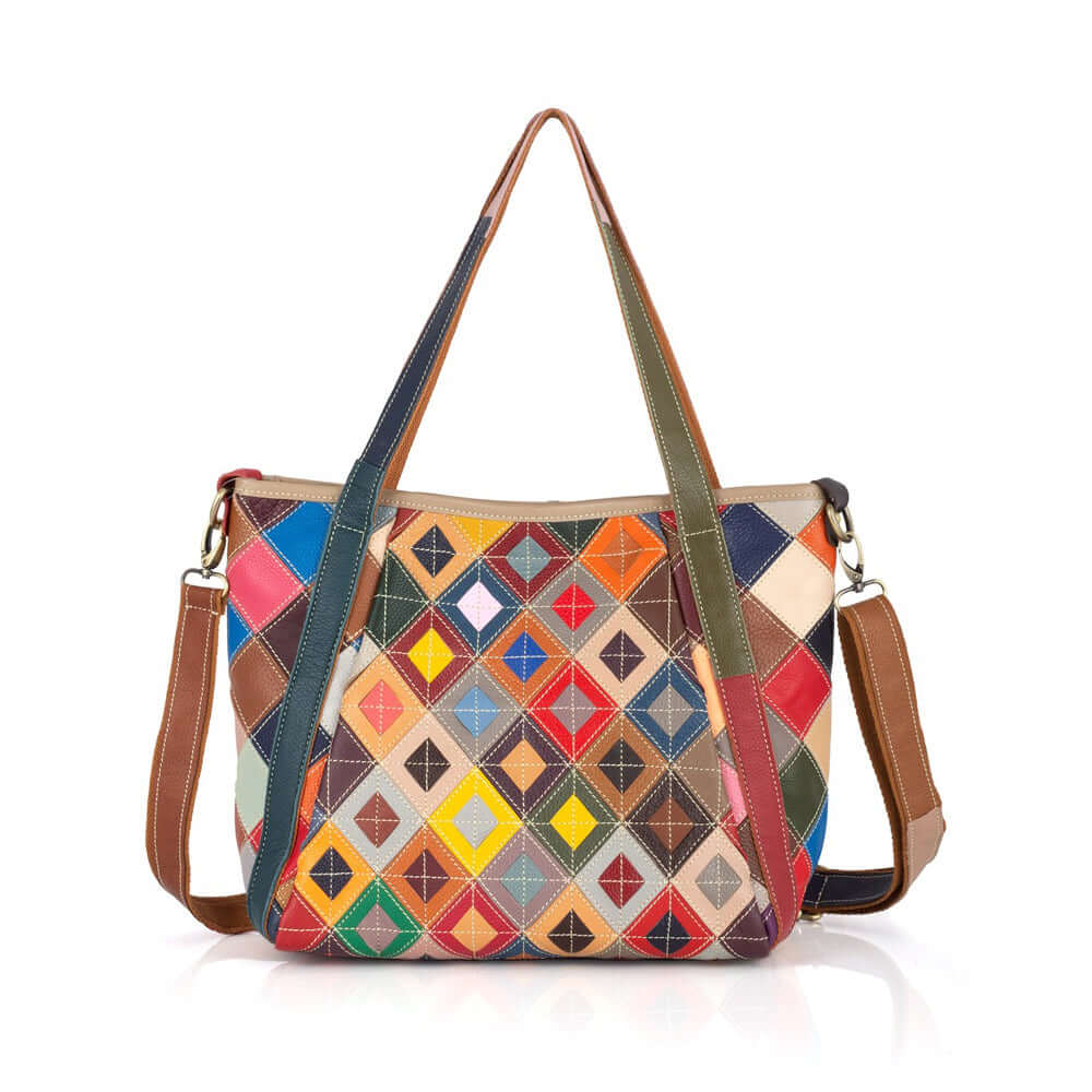 Colorful leather tote bag with adjustable strap for crossbody wear.