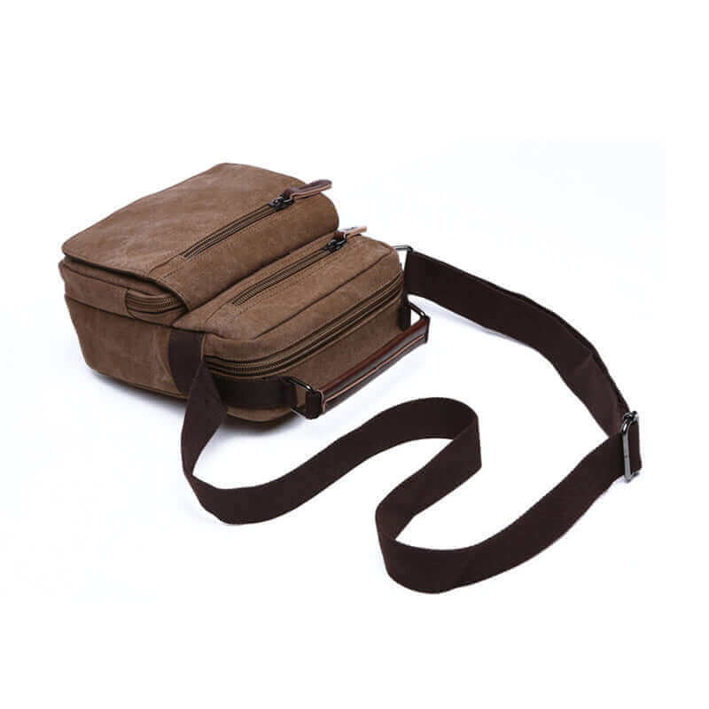 Compact men's canvas crossbody bag, offering style and functionality for various occasions.