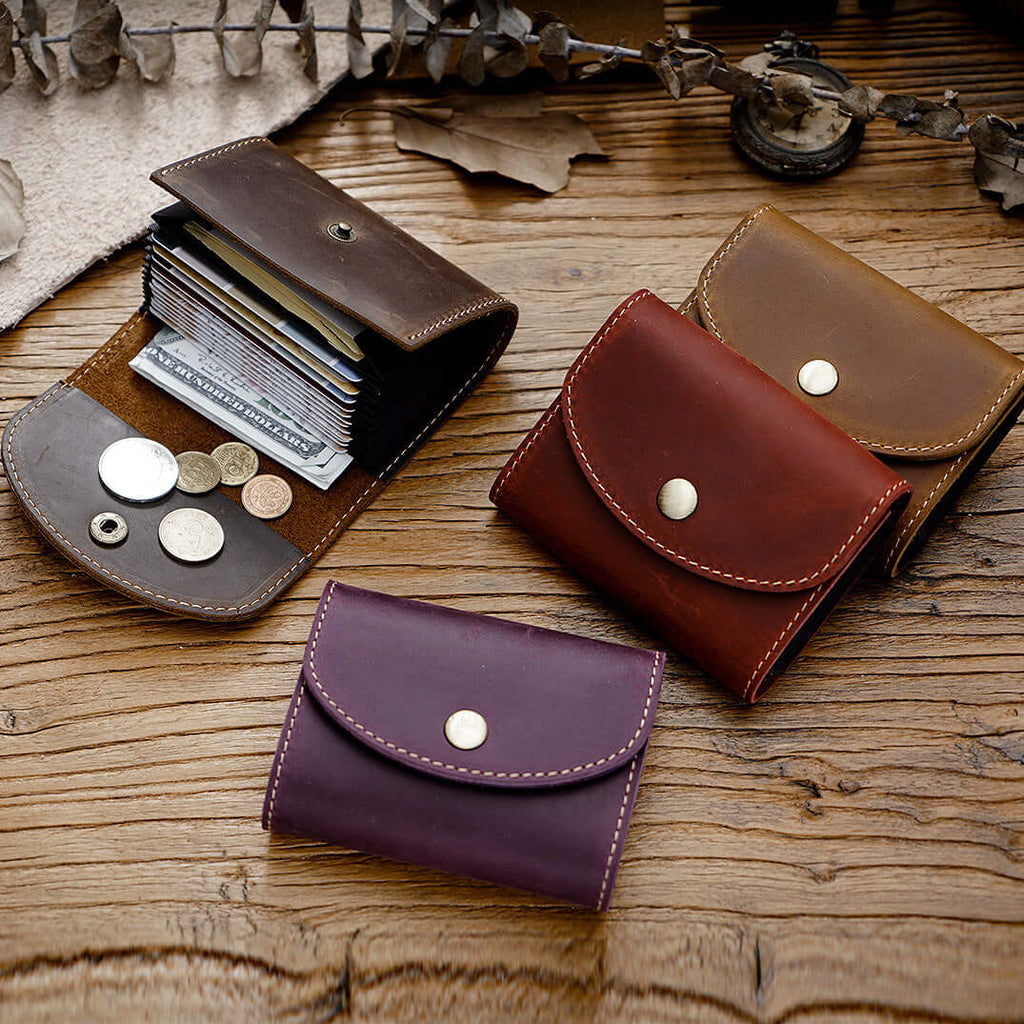 Vintage leather card case displayed on rustic table