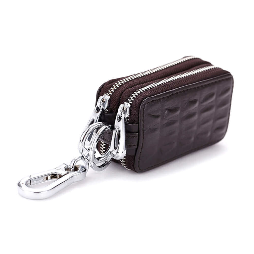 Side view of the leather key case with dual zippers for secure storage.