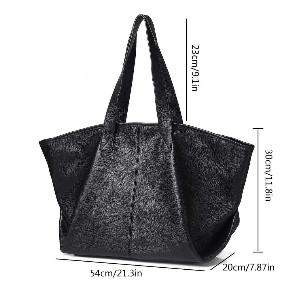 Black leather tote bag styled with a casual outfit for everyday use