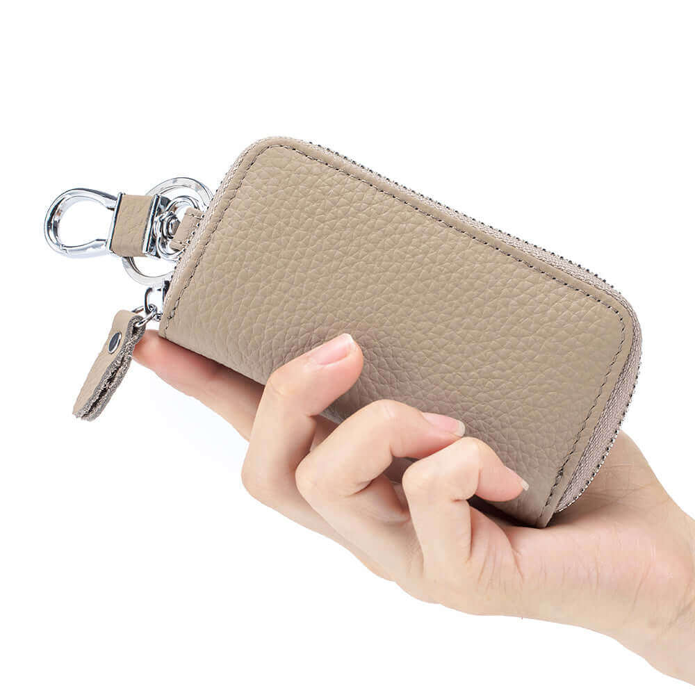 Stylish leather key holder wallet with zipper closure.