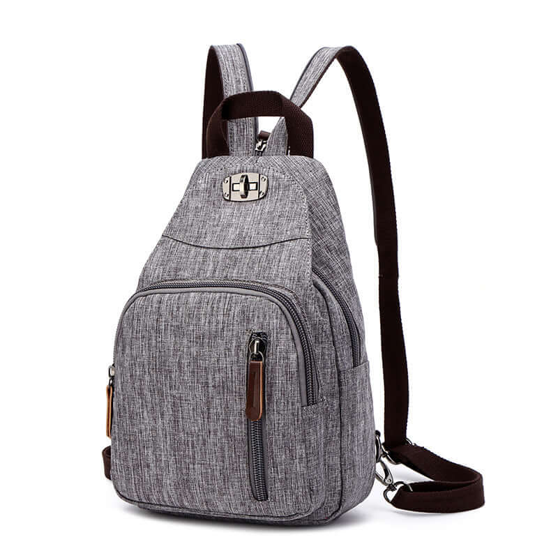 Grey multifunctional backpack worn as sling bag for women