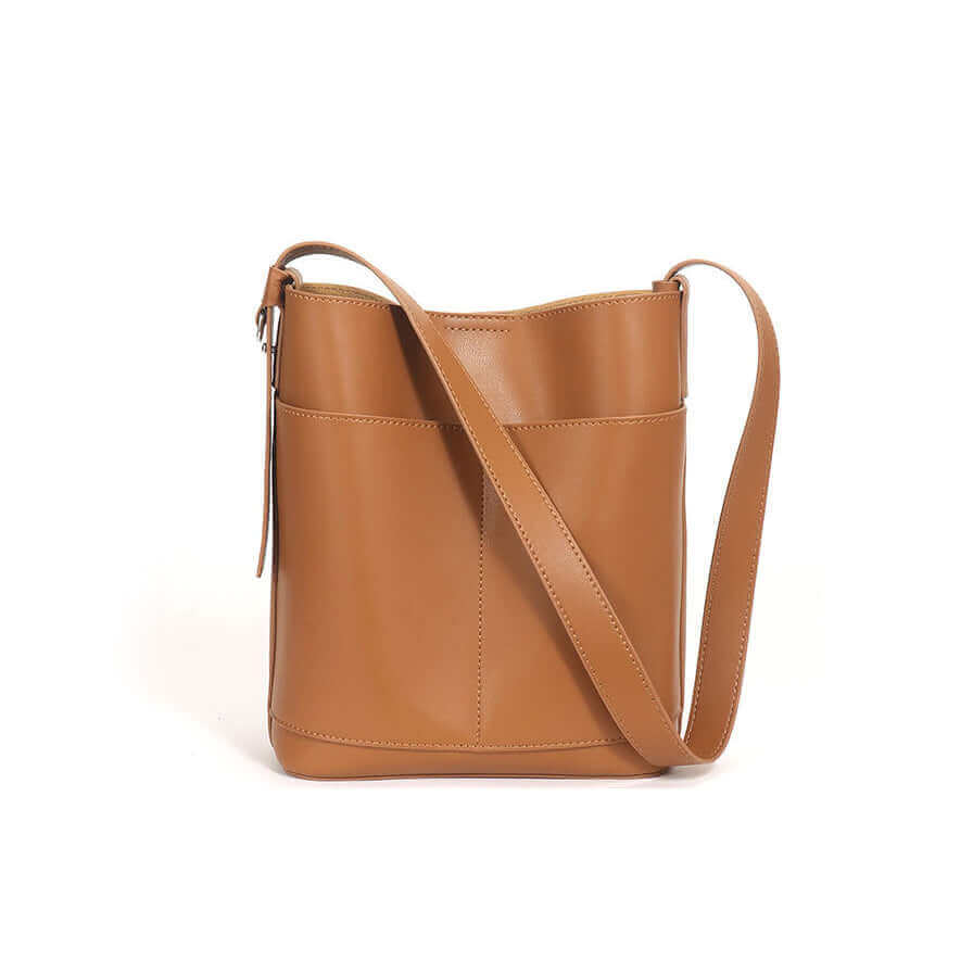  Leather bucket bag showcasing the magnetic closure detail.