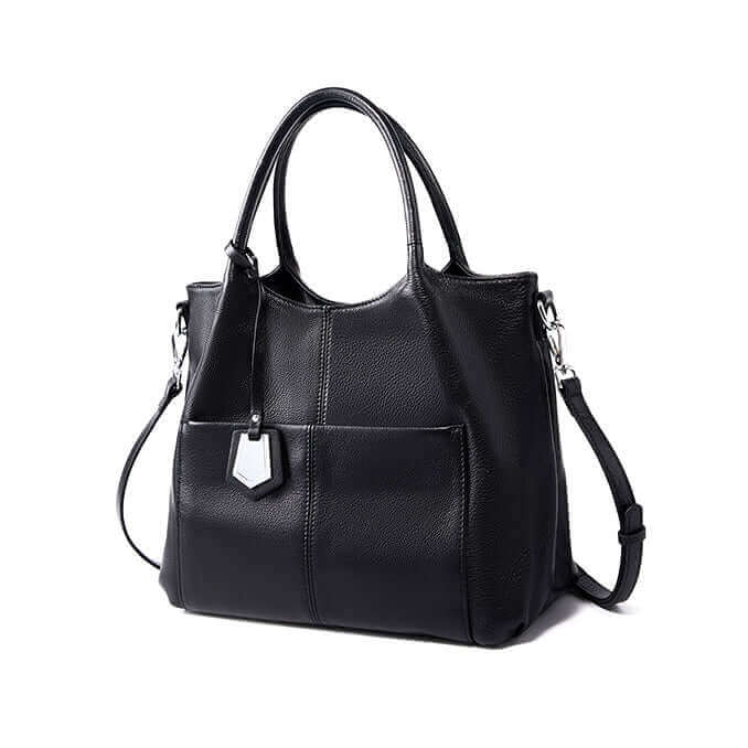 Leather handbag with accessory pocket and adjustable shoulder strap.