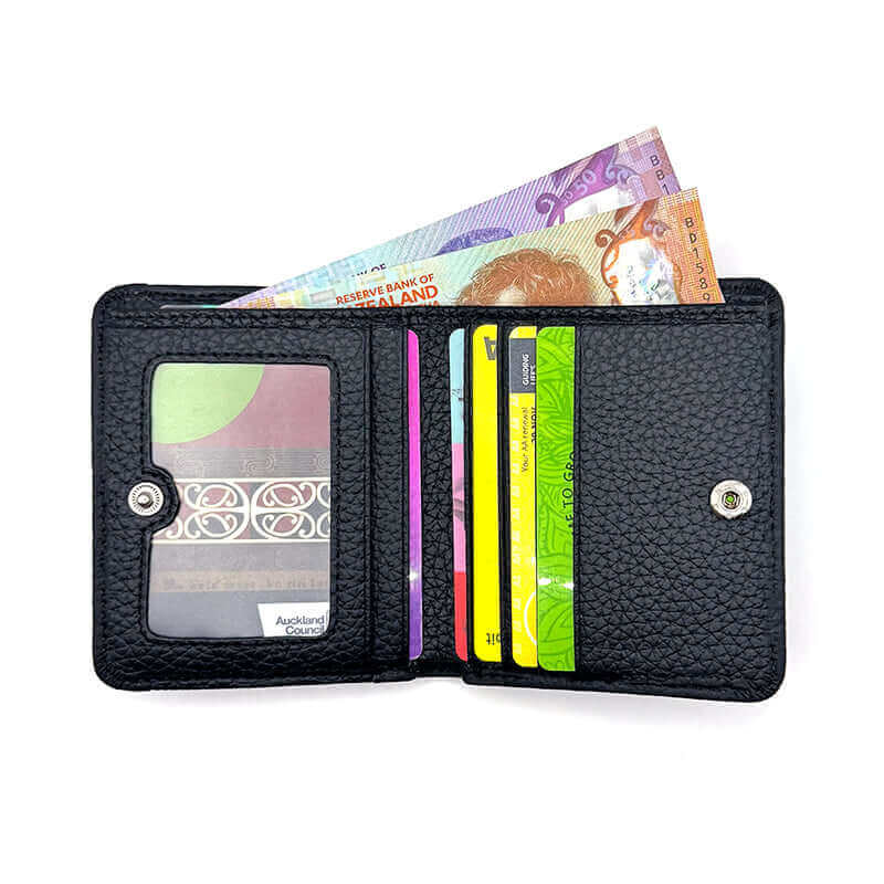 Leather RFID blocking wallet for women with minimalist design, offering practical storage options.