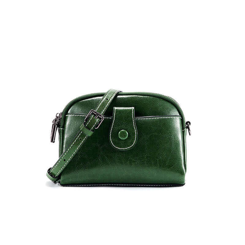 Front slip pocket detail on coffee green leather shoulder bag