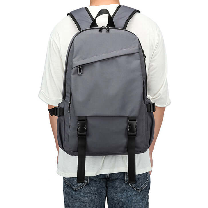 Man wearing grey backpack – ideal for school or daily commuting