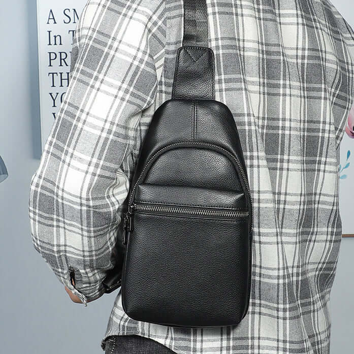 Lightweight and stylish black leather sling bag perfect for men on the go.