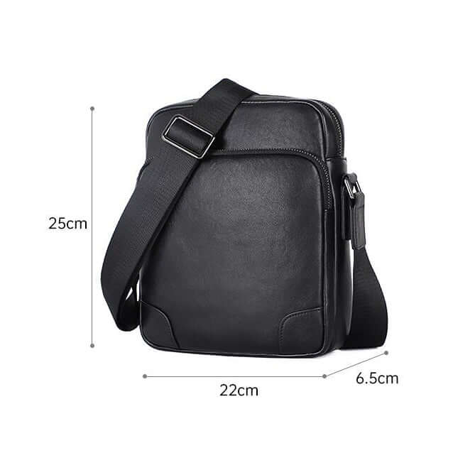 Size comparison of the men's black leather crossbody bag with daily essentials.