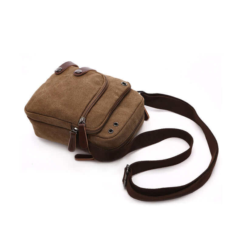 Men's small canvas bag with adjustable strap for comfortable shoulder or crossbody wear.