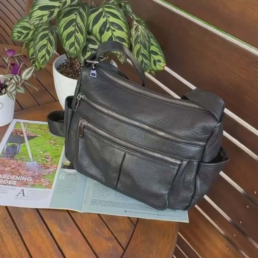 Women's black genuine leather crossbody bag.