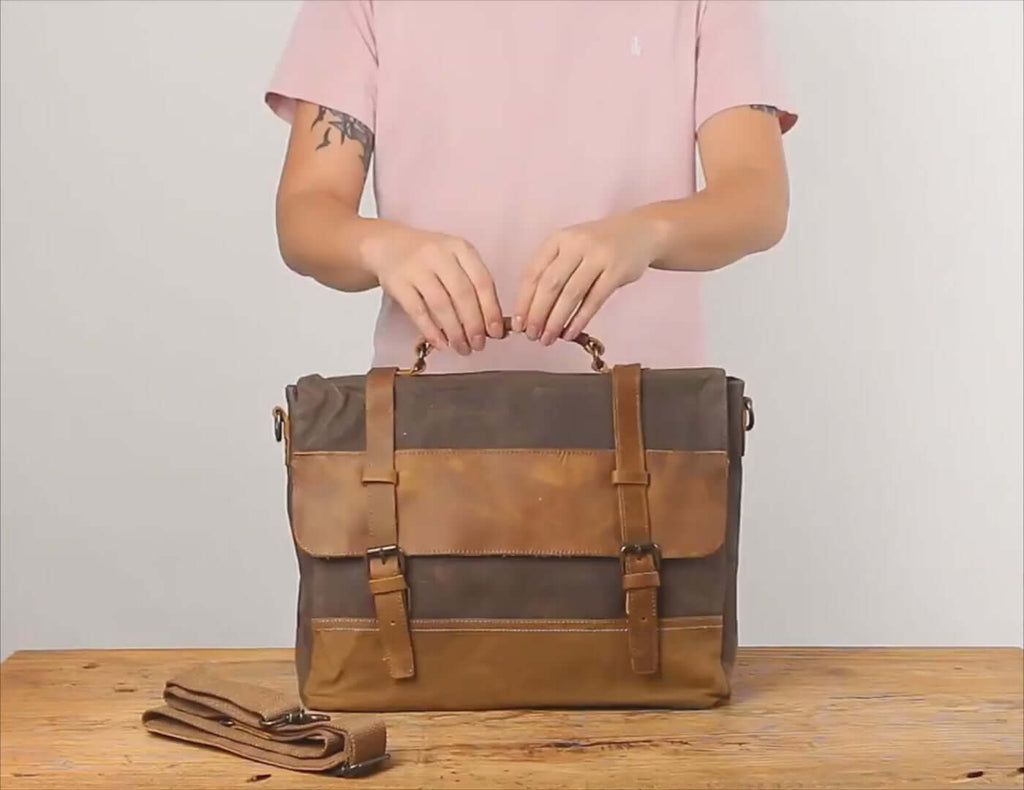 Men's vintage leather and canvas laptop messenger bag, ideal for work and casual wear.