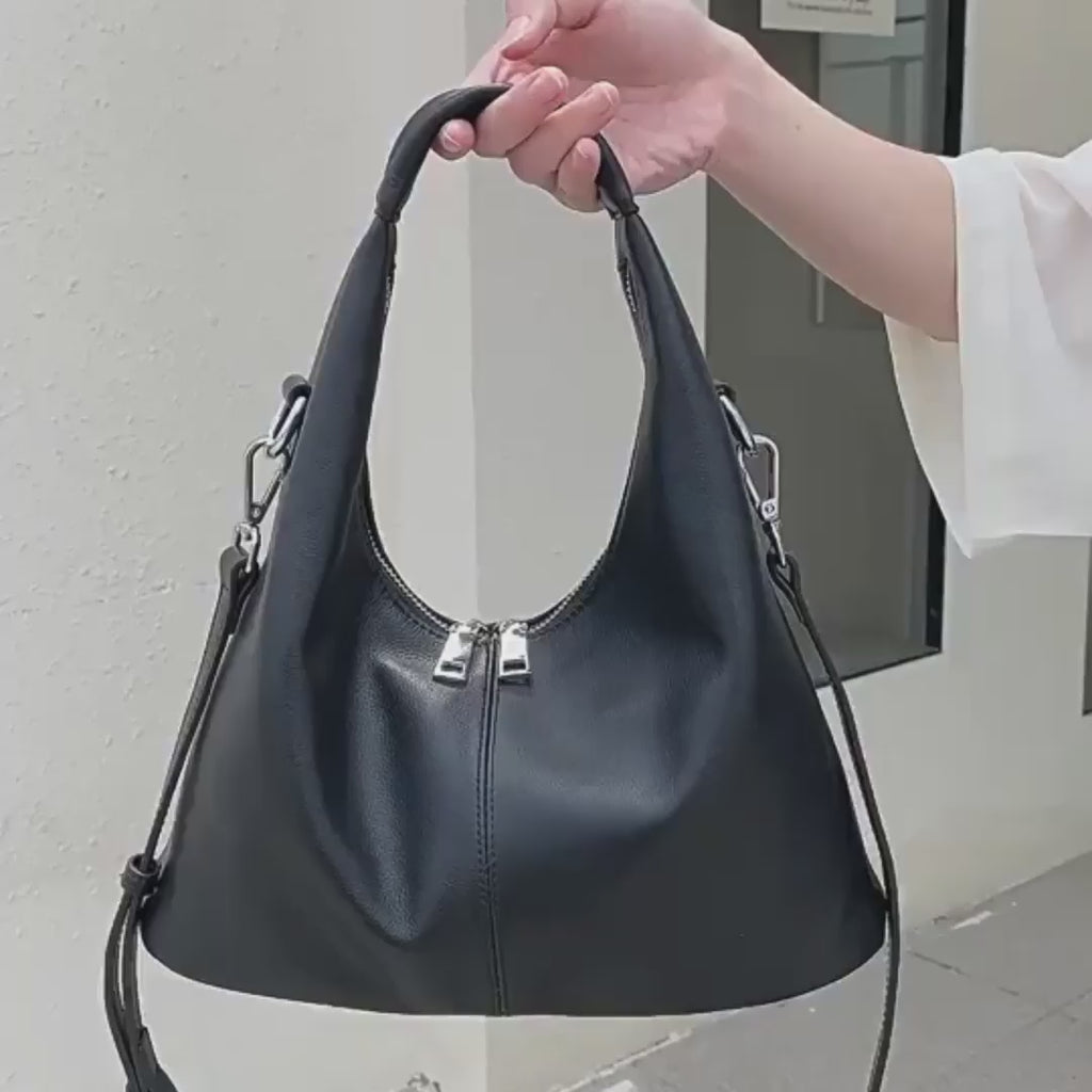 Women's lack leather handbag for work and everyday use.
