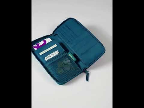 Colorful travel passport wallet with wrist strap for convenience.