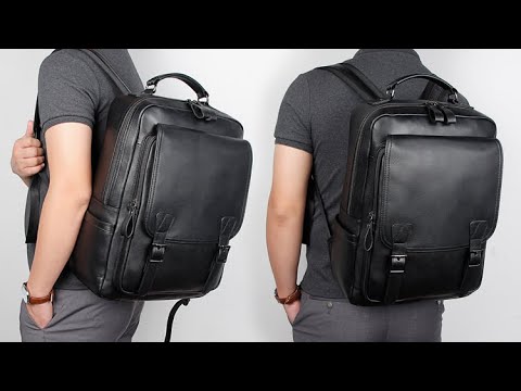 Black leather laptop backpack designed for 14-inch laptops.