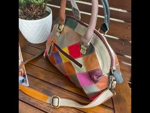 Leather handbag with a multicolor patchwork design and an adjustable strap.