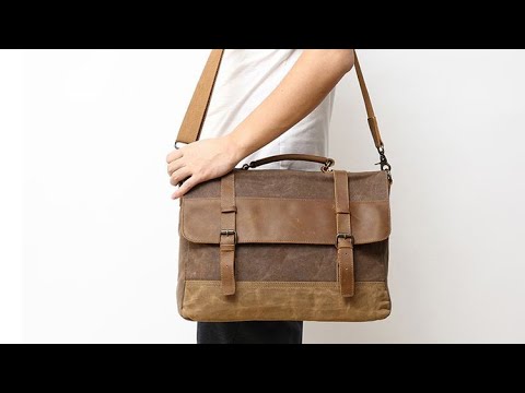 Men's vintage leather and canvas laptop messenger bag, ideal for work and casual wear.