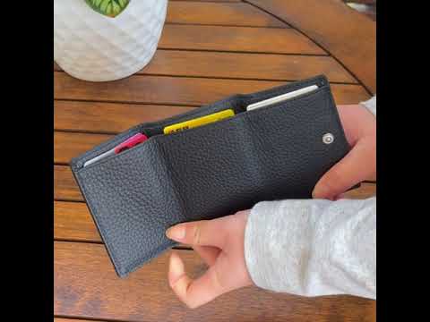 Leather RFID mini wallet for women, offering compact storage for cards, cash, and coins.