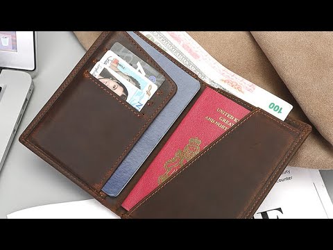 Open view of leather passport holder showing multiple pockets