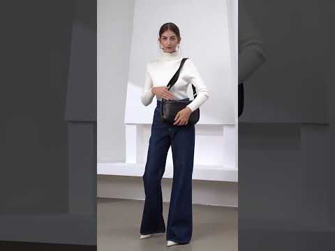 Woman wearing black leather crossbody bag