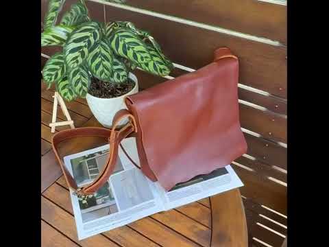 Vintage brown leather crossbody messenger bag for men and women.