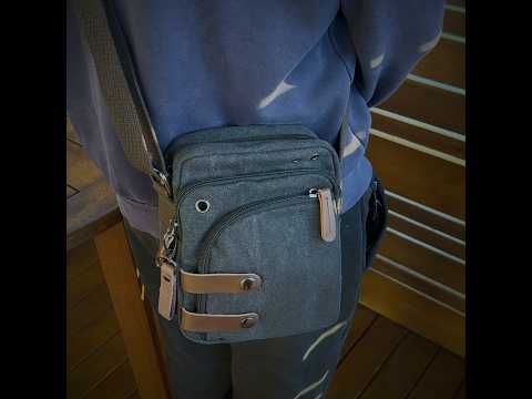 Small canvas crossbody bag for men with PU leather accents.