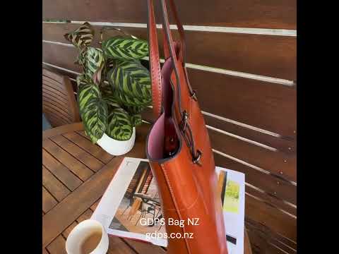 Leather shoulder tote bag, perfect for office use.