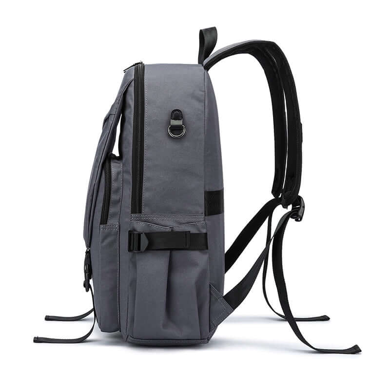 Side view showing pockets and secure zipper of grey laptop backpack